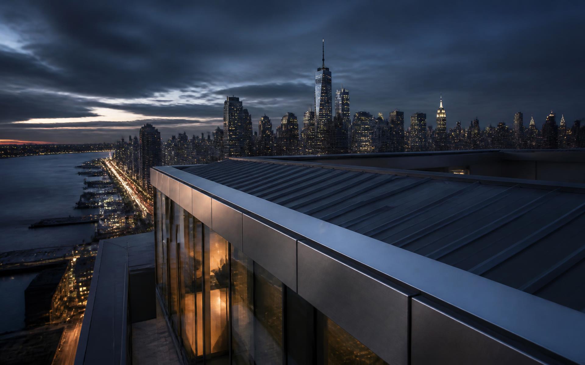New York City skyline at dusk above commercial rooftop HVAC equipment